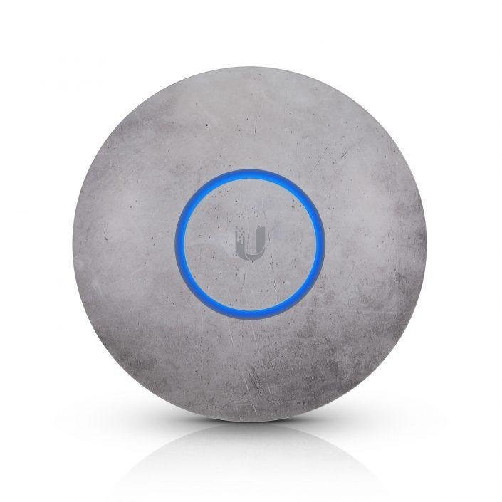 A Ubiquiti UniFi ceiling access point with a concrete-effect decorative cover