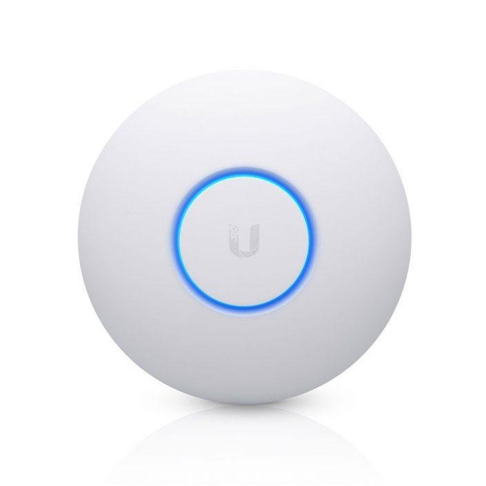 A white circular Ubiquiti UniFi ceiling and wall mount access point